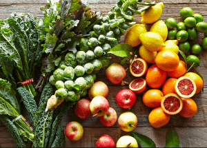 a group of fruits and vegetables on a wood surface Healthy Weight Loss Diets Basildon