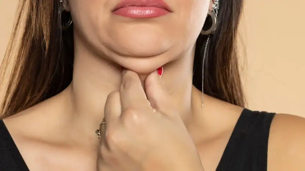 An image of a woman with double chin, sad, worried : Non Surgical Double Chin Removal Treatment in Basildon, UK